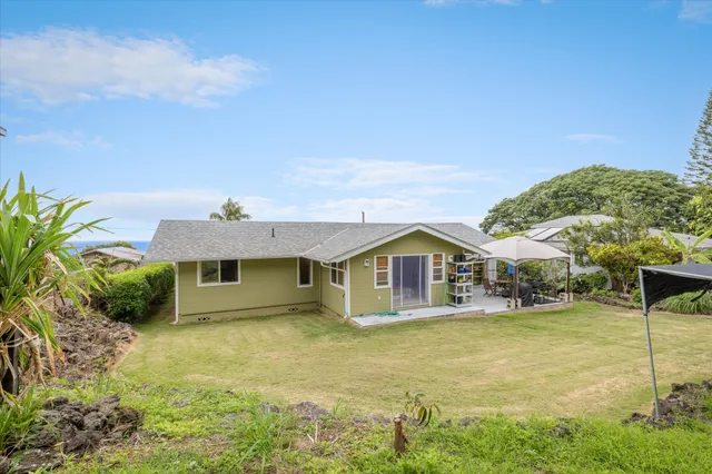 a view of a backyard of the house