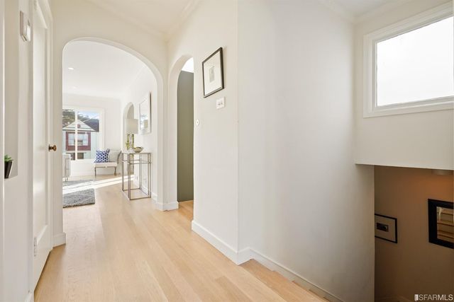 a living room with furniture a fireplace and a table