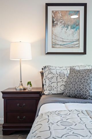 a kitchen with a refrigerator a stove a dining table and chairs