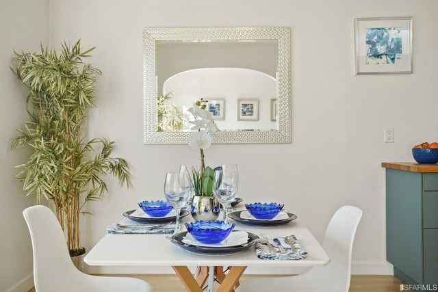 a kitchen with stainless steel appliances granite countertop a cabinets sink and wooden floor