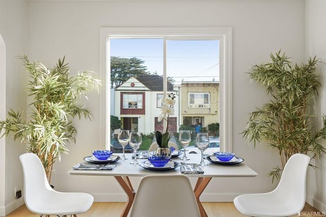 a kitchen with stainless steel appliances a sink dishwasher stove refrigerator and microwave