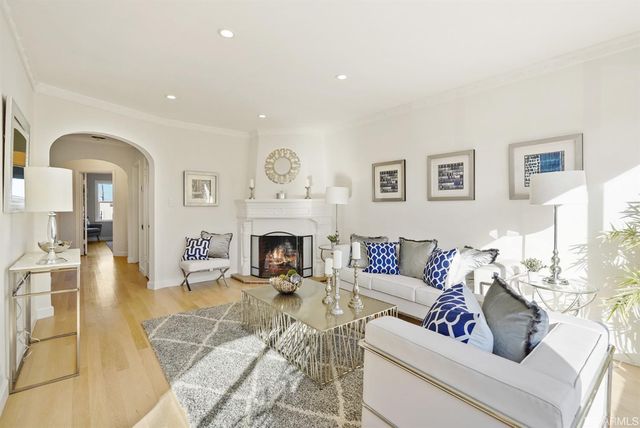 a bathroom with a sink mirror and toilet