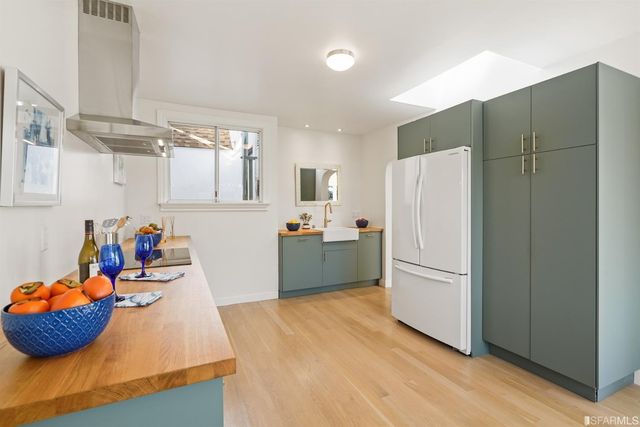 a bedroom with double bed and a dresser