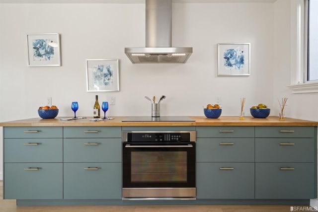 a view of a bathroom with a sink and a mirror