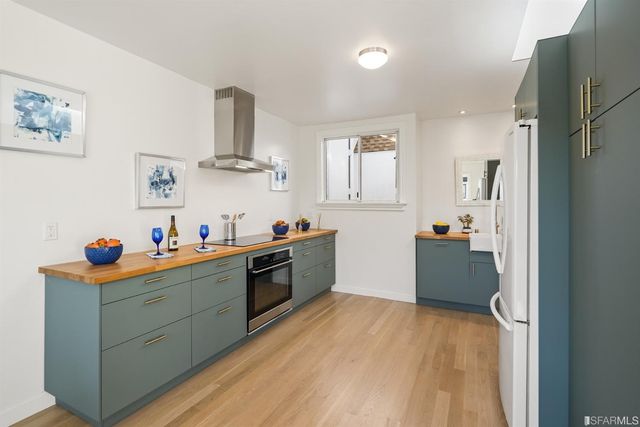 a bedroom with a bed and painting on the wall