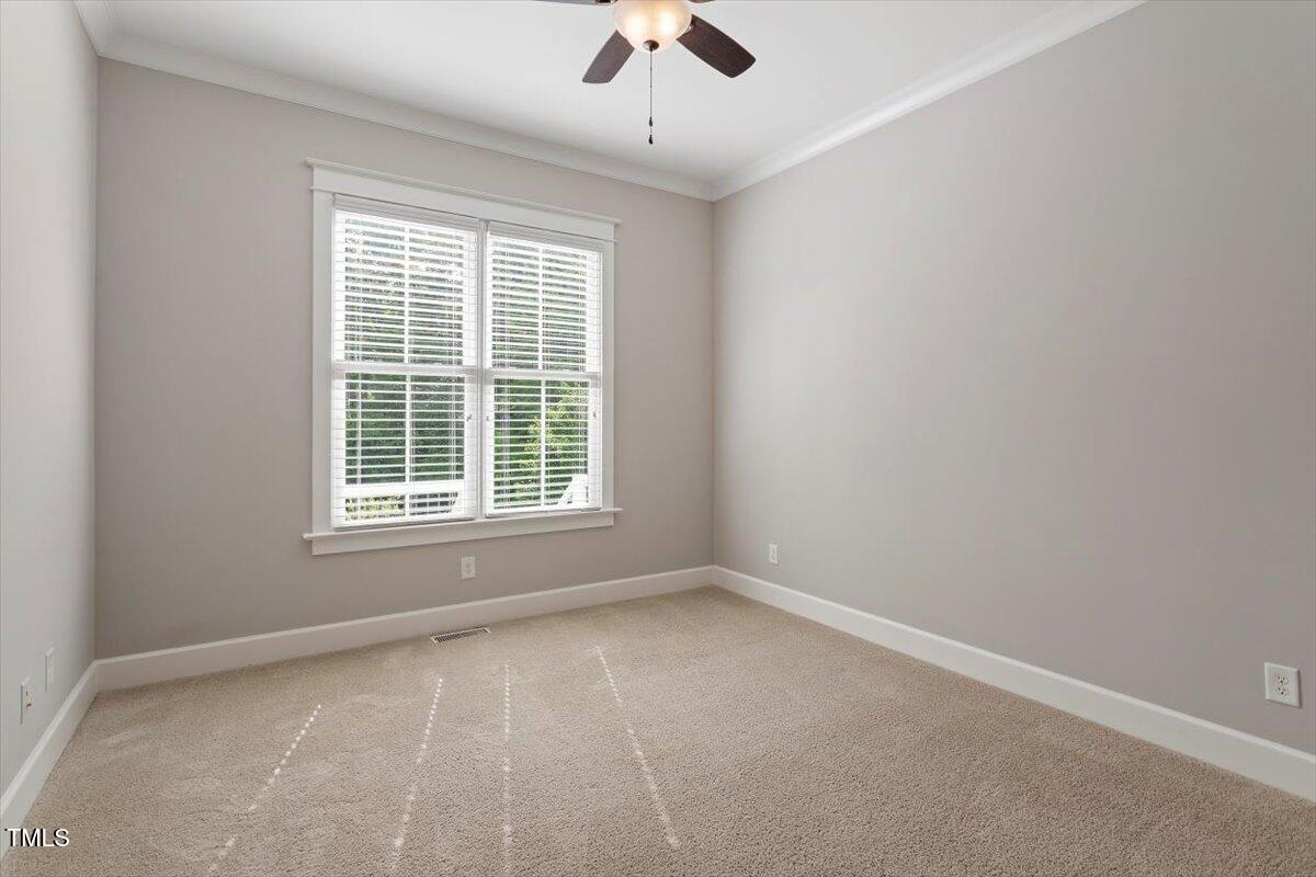 612 Hawks Ridge Court Apex, NC 27539 - Photo 32 of 58 a view of an empty room with a window