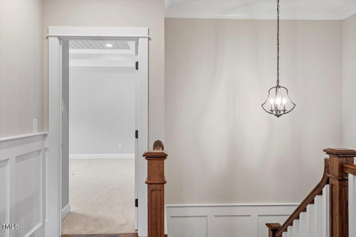 612 Hawks Ridge Court Apex, NC 27539 - Photo 38 of 58 a view of a room with a hanging light and a window