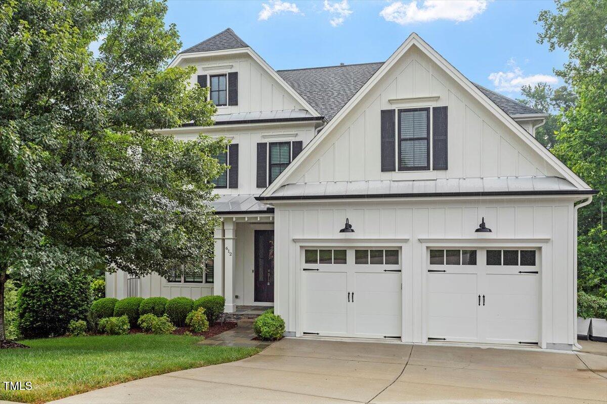 612 Hawks Ridge Court Apex, NC 27539 - Photo 4 of 58 a front view of a house with a yard