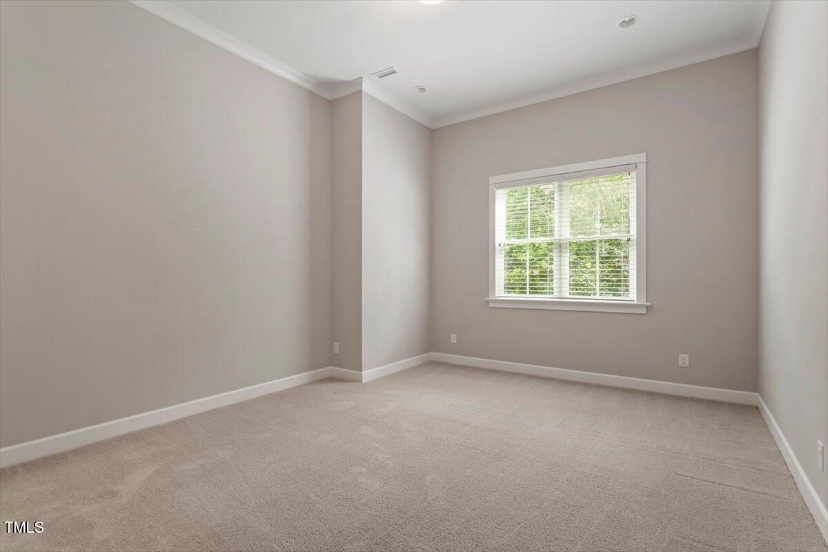 612 Hawks Ridge Court Apex, NC 27539 - Photo 52 of 58 an empty room with windows