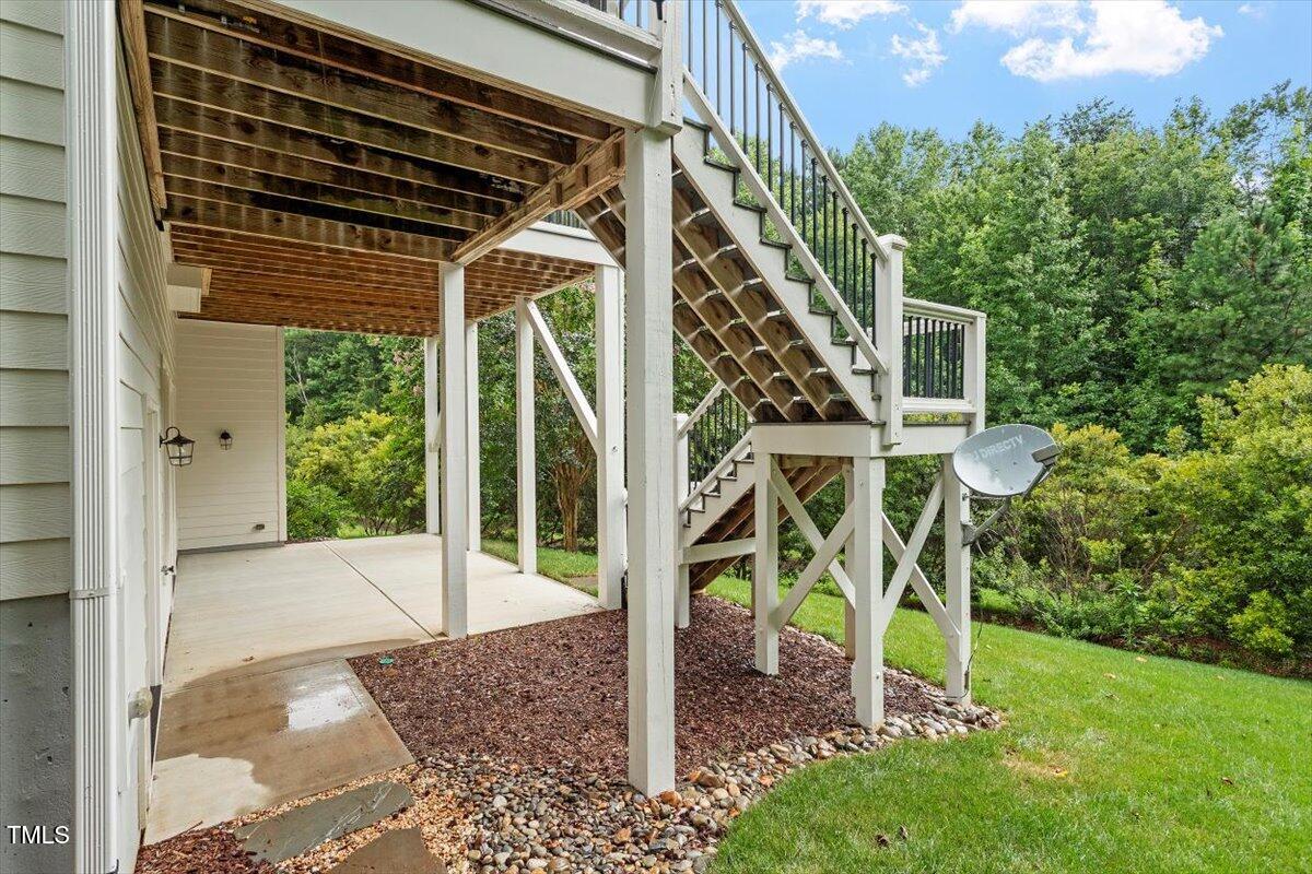 612 Hawks Ridge Court Apex, NC 27539 - Photo 55 of 58 a view of a patio with table and chairs and potted plants