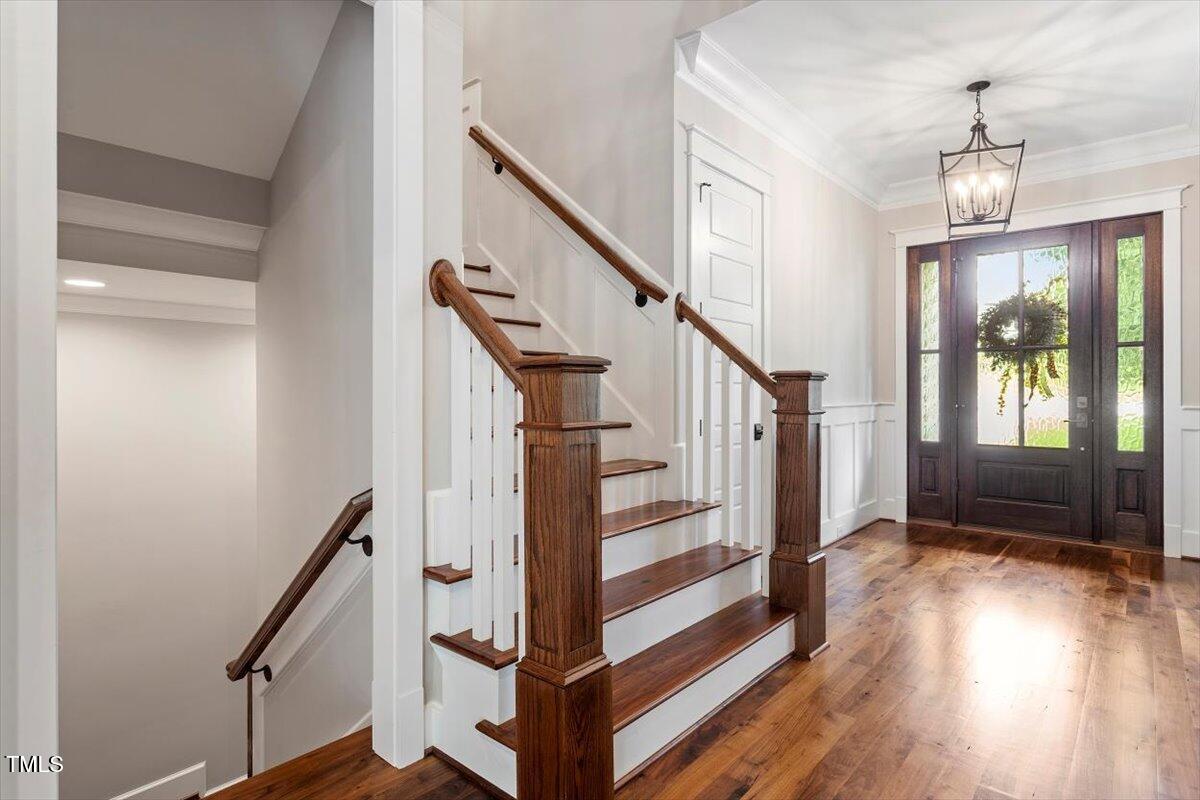 612 Hawks Ridge Court Apex, NC 27539 - Photo 7 of 58 a view of entryway and hall with wooden floor