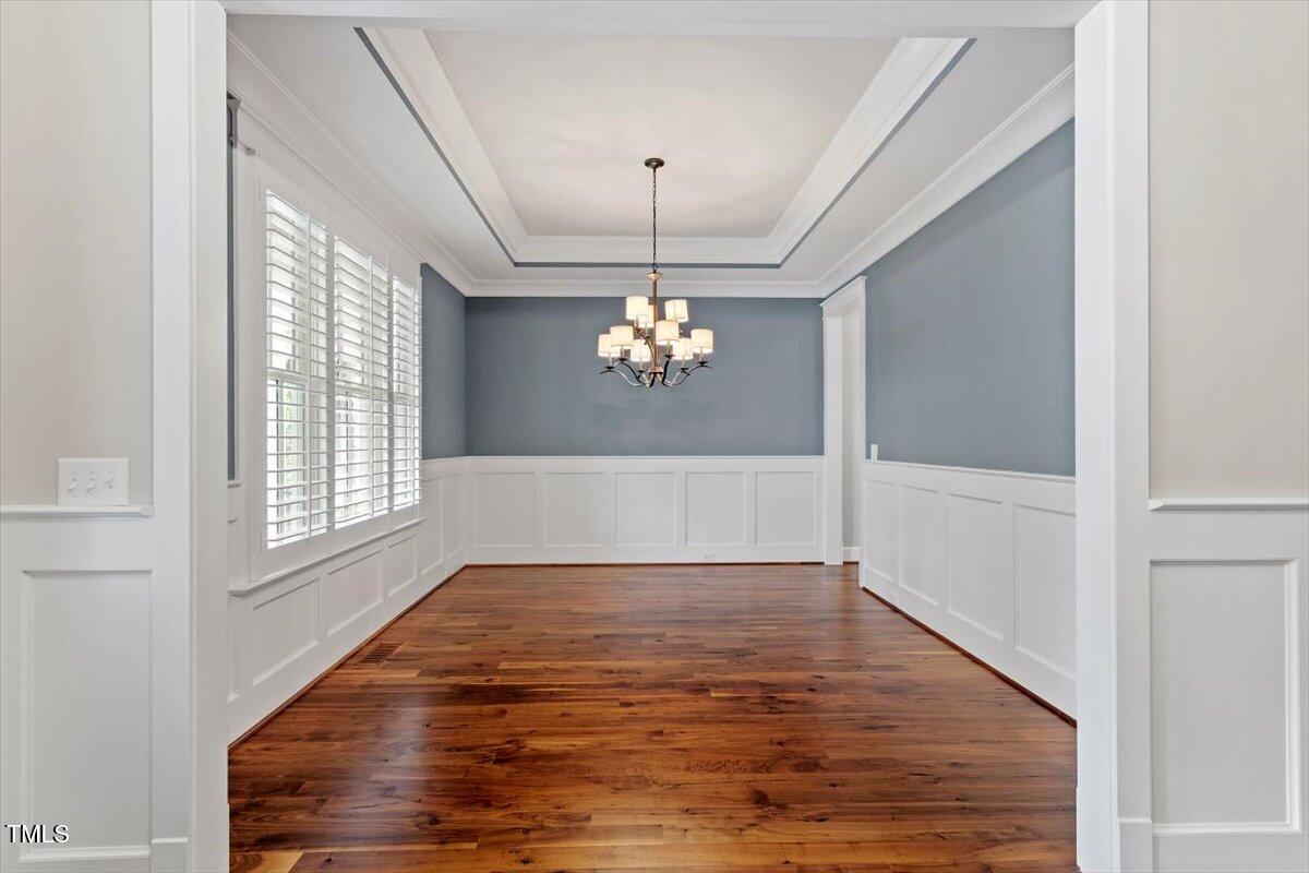 612 Hawks Ridge Court Apex, NC 27539 - Photo 9 of 58 a view of a livingroom with a ceiling fan window and wooden floor