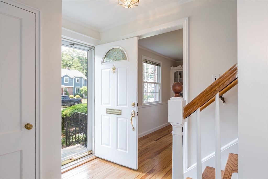 16 Surrey Lane Natick, MA 01760 - Photo 14 of 28 a view of entryway with wooden floor and stairs