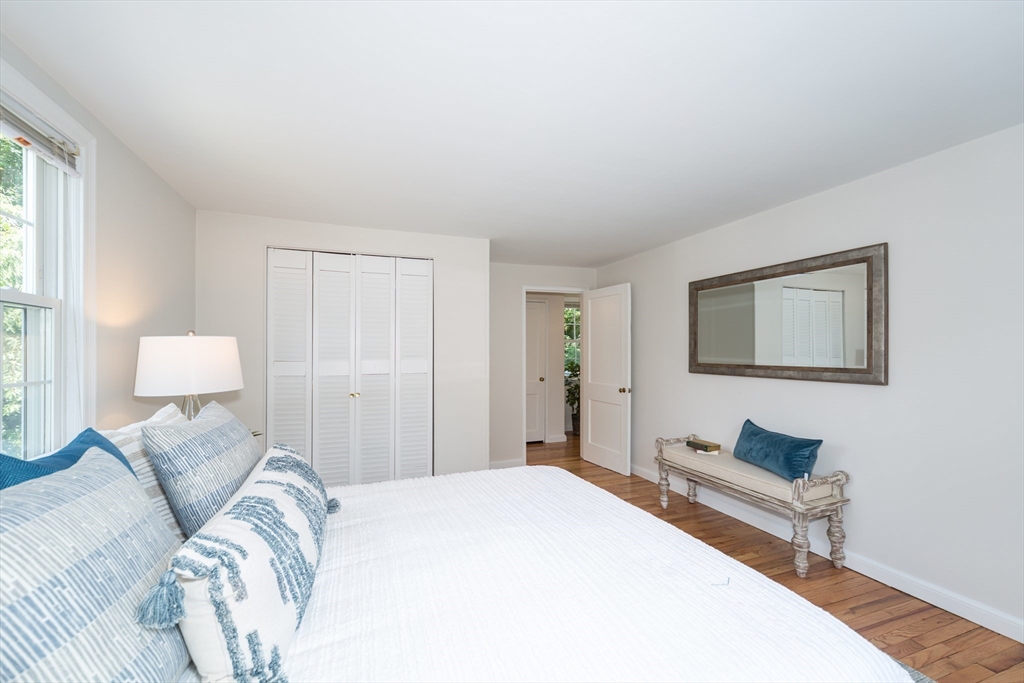 16 Surrey Lane Natick, MA 01760 - Photo 17 of 28 a bedroom with a bed and a lamp