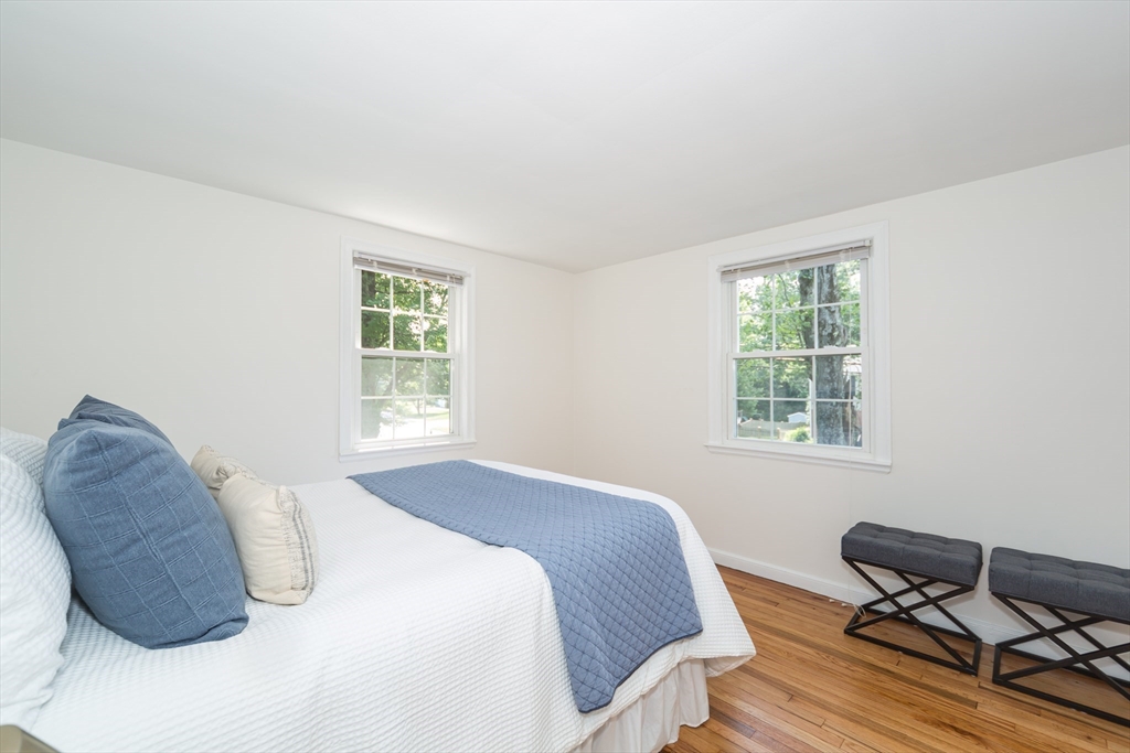 16 Surrey Lane Natick, MA 01760 - Photo 18 of 28 a bedroom with a bed chair and a window