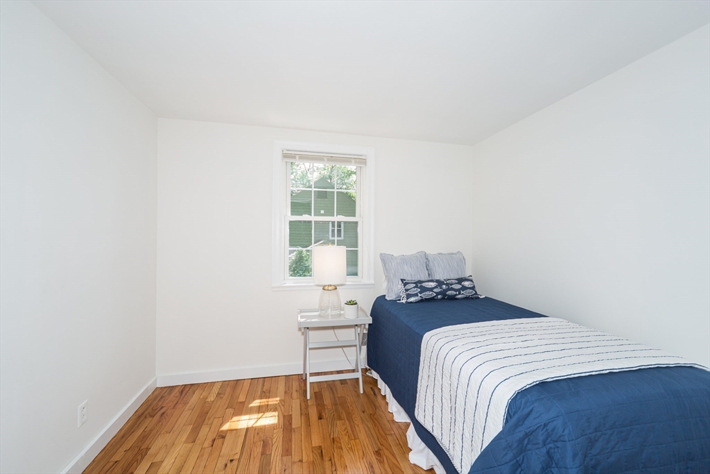 16 Surrey Lane Natick, MA 01760 - Photo 20 of 28 a bedroom with a bed and a window