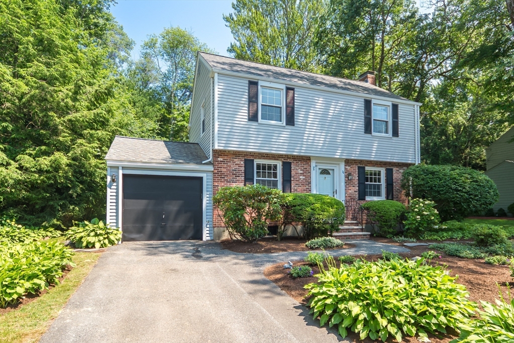 16 Surrey Lane Natick, MA 01760 - Photo 2 of 28 a front view of a house with a yard