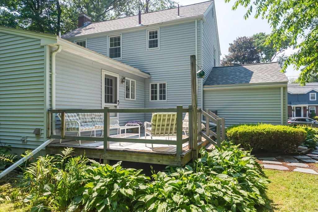 16 Surrey Lane Natick, MA 01760 - Photo 24 of 28 a front view of a house with garden