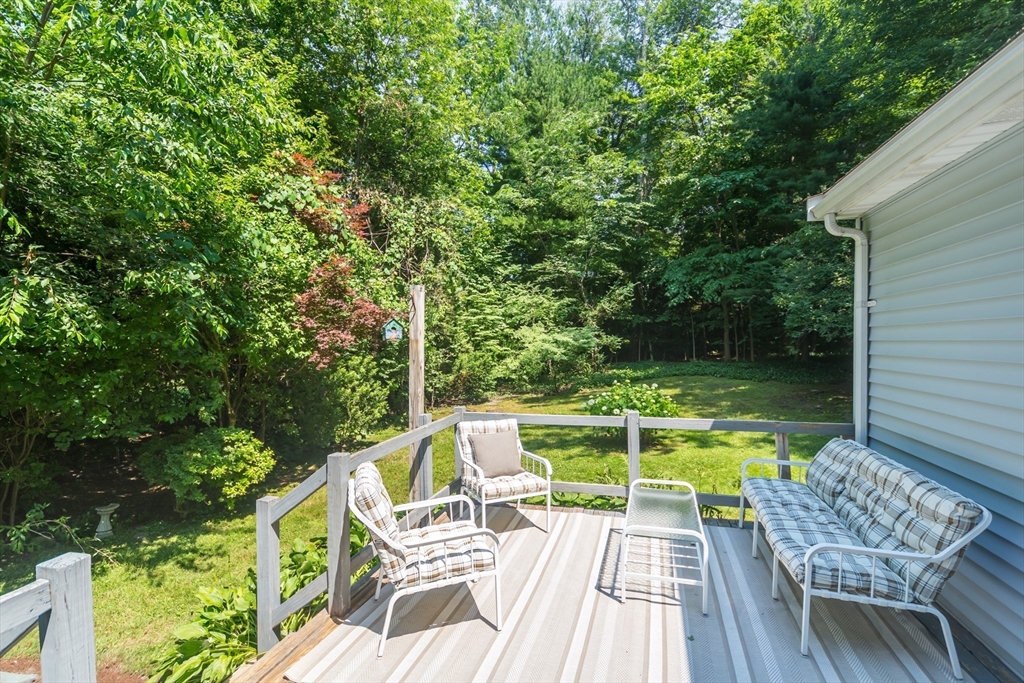 16 Surrey Lane Natick, MA 01760 - Photo 25 of 28 a view of a chair and table on the deck