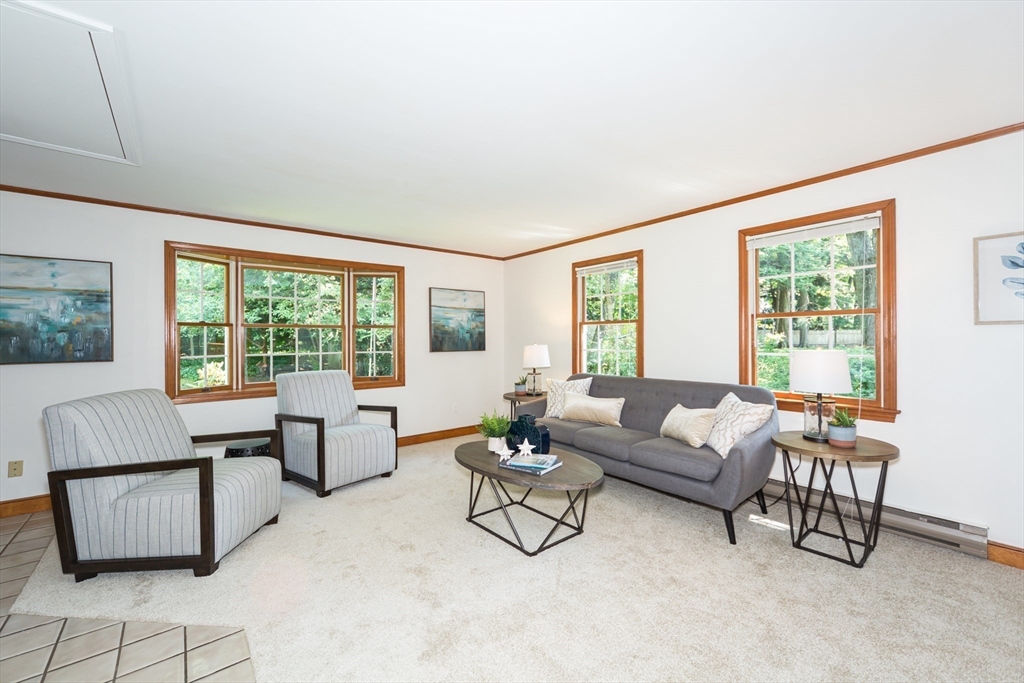 16 Surrey Lane Natick, MA 01760 - Photo 3 of 28 a living room with furniture and floor to ceiling window