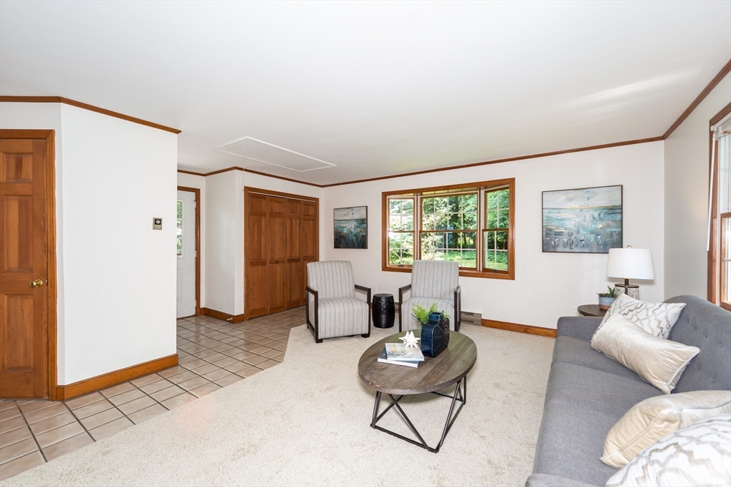 16 Surrey Lane Natick, MA 01760 - Photo 5 of 28 a living room with furniture and a window