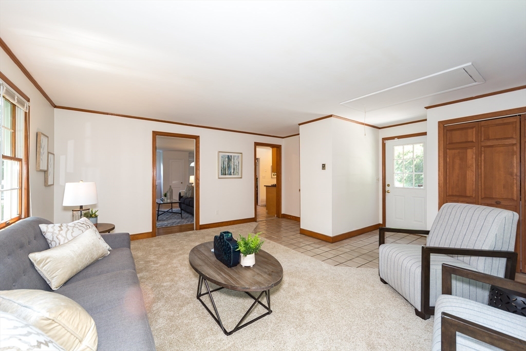 16 Surrey Lane Natick, MA 01760 - Photo 6 of 28 a living room with furniture and a window