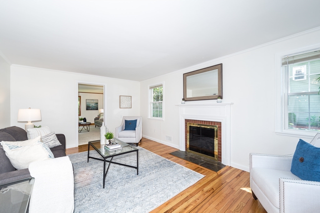 16 Surrey Lane Natick, MA 01760 - Photo 7 of 28 a living room with furniture and a fireplace