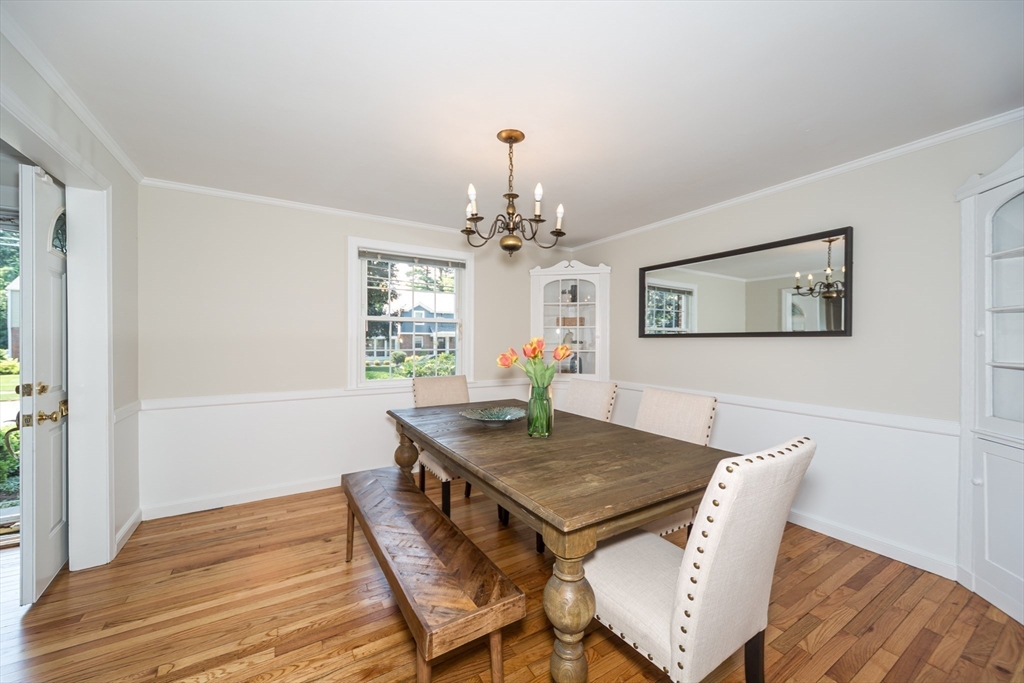 16 Surrey Lane Natick, MA 01760 - Photo 10 of 28 a view of a dining room with furniture and wooden floor