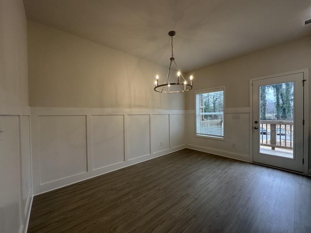 814 Glennferry Bend Southwest Mableton, GA 30126 - Photo 9 of 33 a view of an empty room with wooden floor and a window