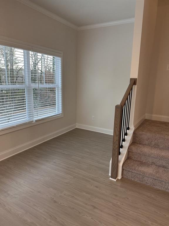 814 Glennferry Bend Southwest Mableton, GA 30126 - Photo 10 of 33 wooden floor in an empty room with a window