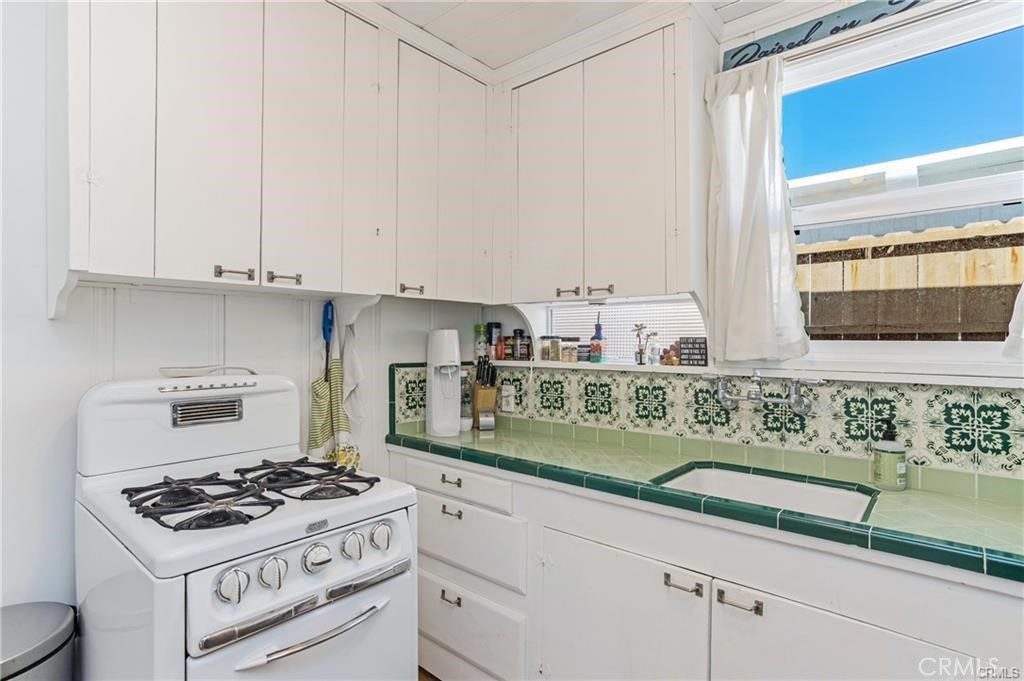 31711 Fairview Road Laguna Beach, CA 92651 - Photo 13 of 20 a kitchen with stainless steel appliances granite countertop a sink stove and cabinets