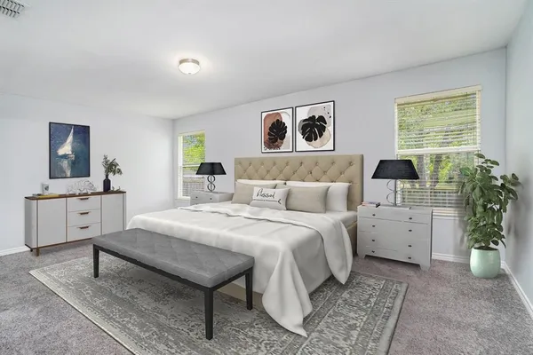 a spacious bedroom with a bed and a desk