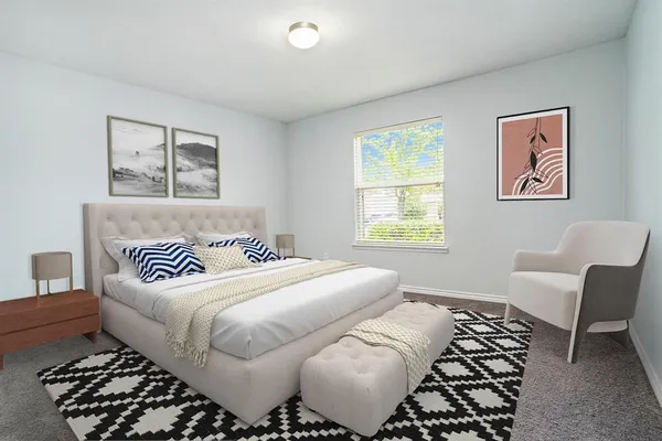a bedroom with a bed and a chair
