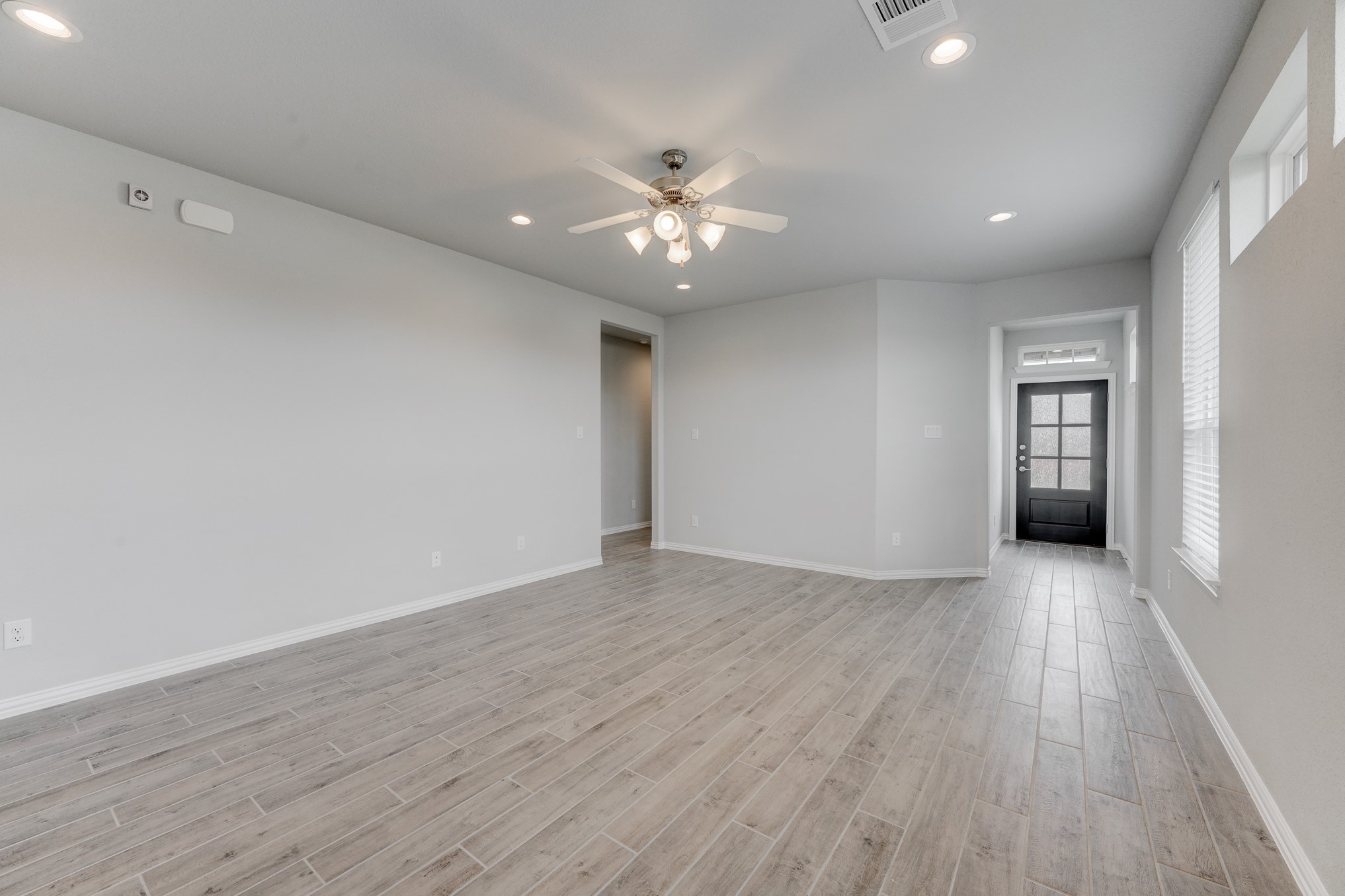 10505 Stone Peak Drive Rosharon, TX 77583 - Photo 7 of 29 Noticing the modern front door, high ceilings & tile flooring