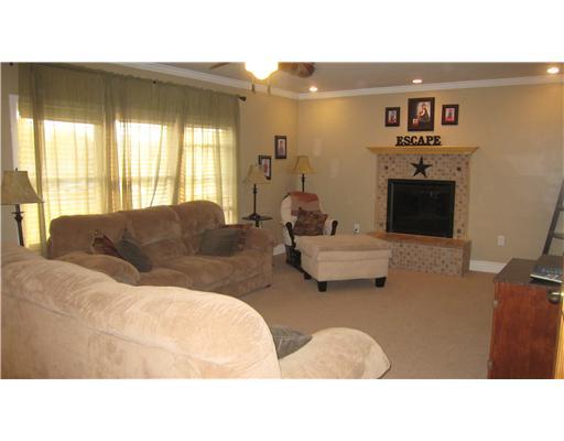 152 Winterset Road Economy, PA 15005 - Photo 3 of 18 Living Room. Wonderful spacious living room with fireplace, brand new carpet, recessed lighting, ceiling fan and crown molding.
