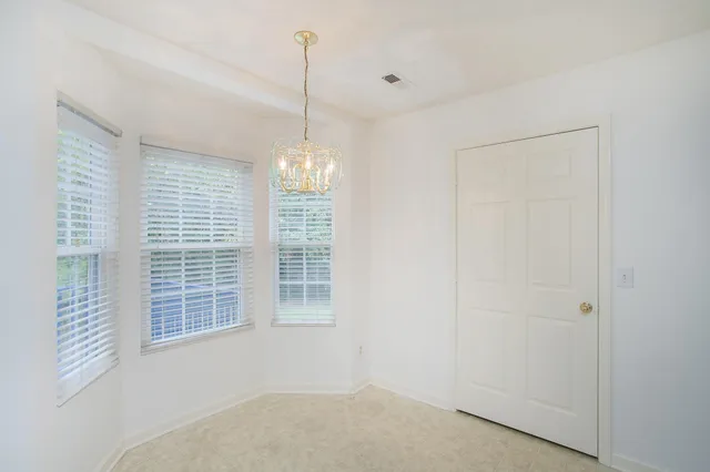 a view of empty room with windows