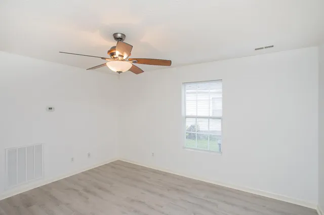 a a chandelier fan in a room