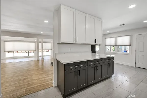 a kitchen with granite countertop a stove and a sink