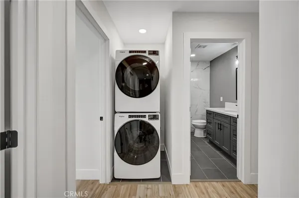 a view of a hallway with washer and dryer