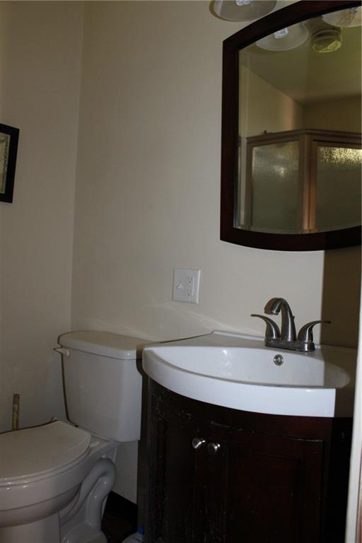 283 Freeport Road Creighton, PA 15030 - Photo 20 of 25 a bathroom with a sink a mirror and toilet