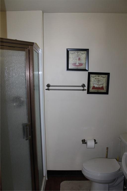 283 Freeport Road Creighton, PA 15030 - Photo 21 of 25 a bathroom with a toilet and a mirror