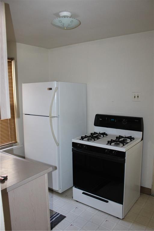 283 Freeport Road Creighton, PA 15030 - Photo 22 of 25 a stove top oven sitting inside of a kitchen