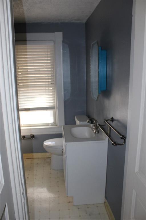 283 Freeport Road Creighton, PA 15030 - Photo 24 of 25 a bathroom with a sink toilet and window