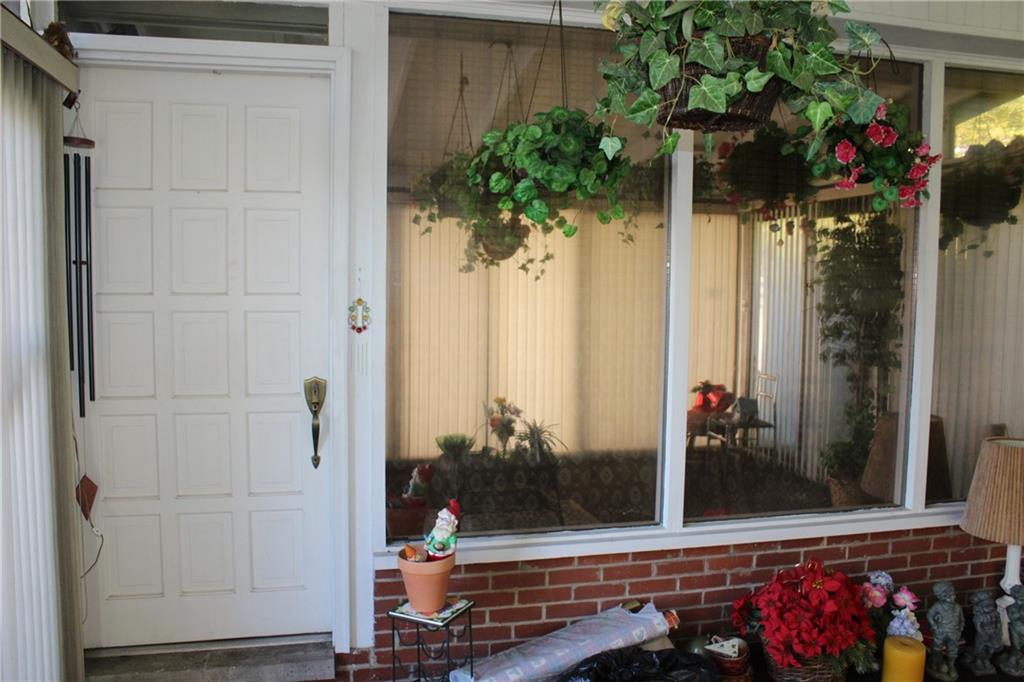 283 Freeport Road Creighton, PA 15030 - Photo 5 of 25 a potted plant sitting in front of a door