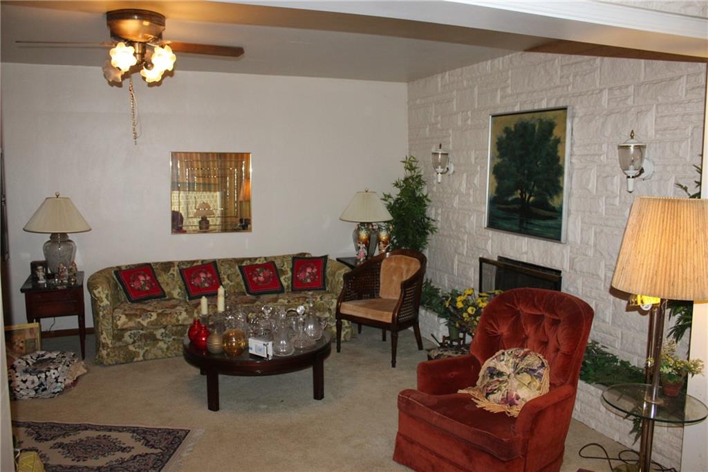 283 Freeport Road Creighton, PA 15030 - Photo 7 of 25 a living room with furniture and a chandelier