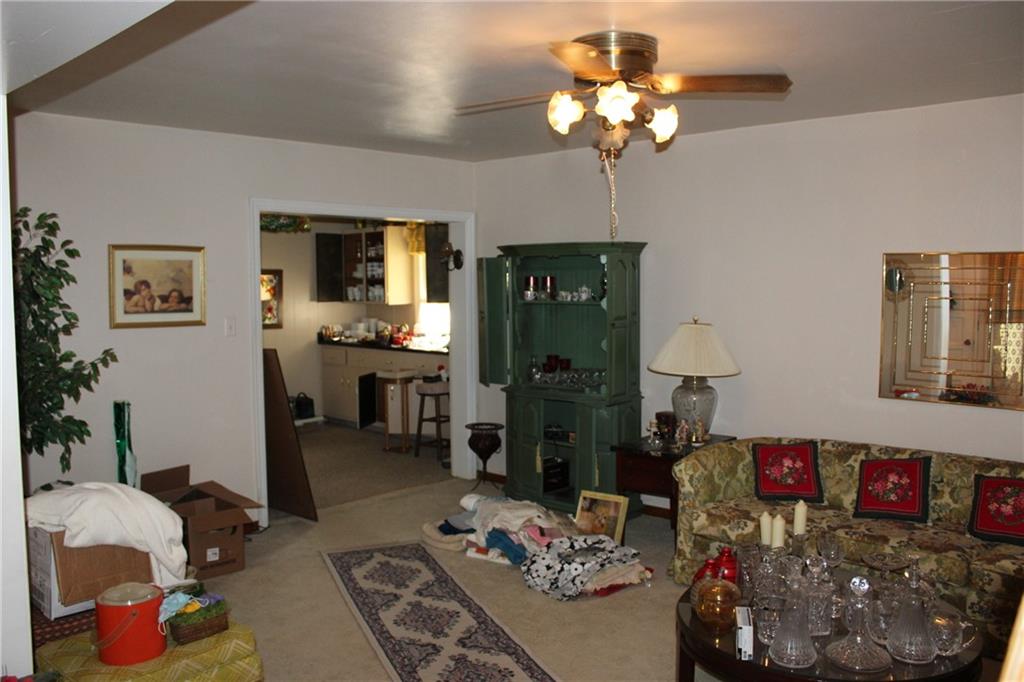 283 Freeport Road Creighton, PA 15030 - Photo 8 of 25 a living room with furniture flowerpot and a chandelier