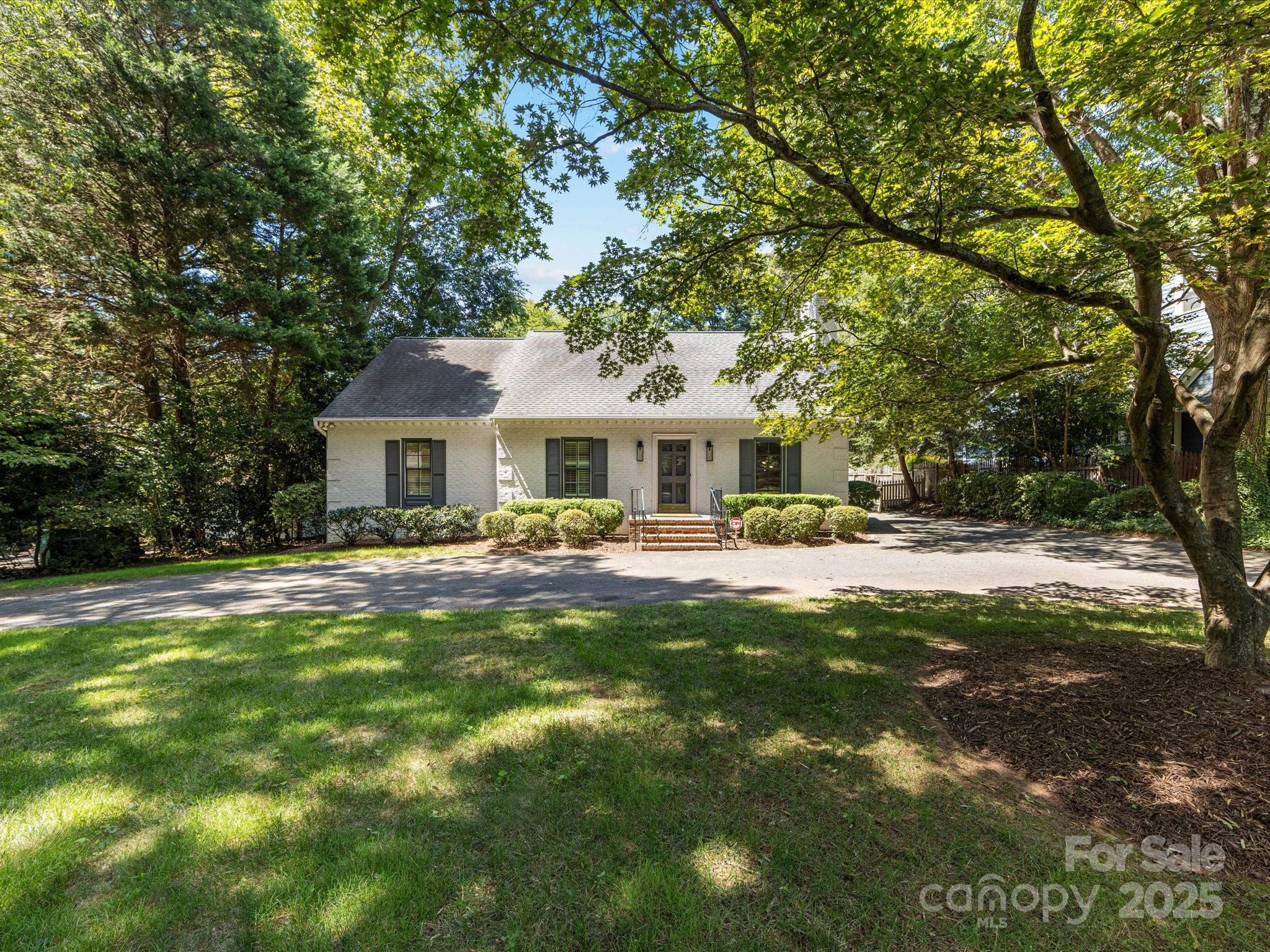 a front view of a house with swimming pool having outdoor seating