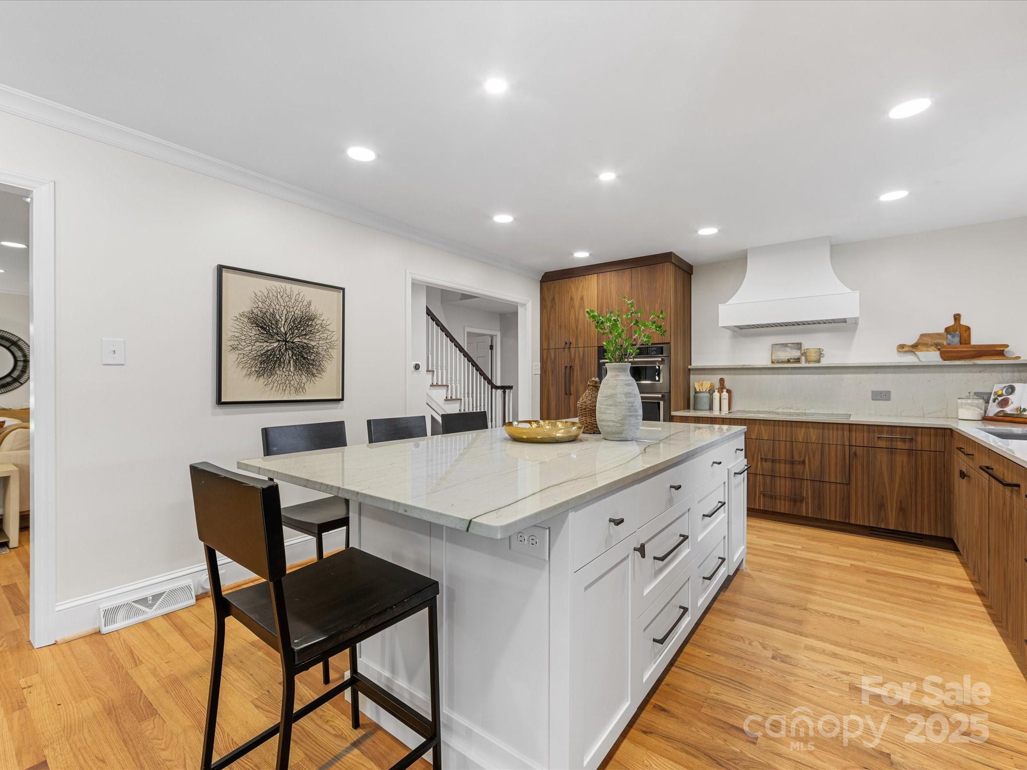 2118 Sharon Road Charlotte, NC 28207 - Photo 11 of 48 a large kitchen with stainless steel appliances granite countertop a sink and a refrigerator