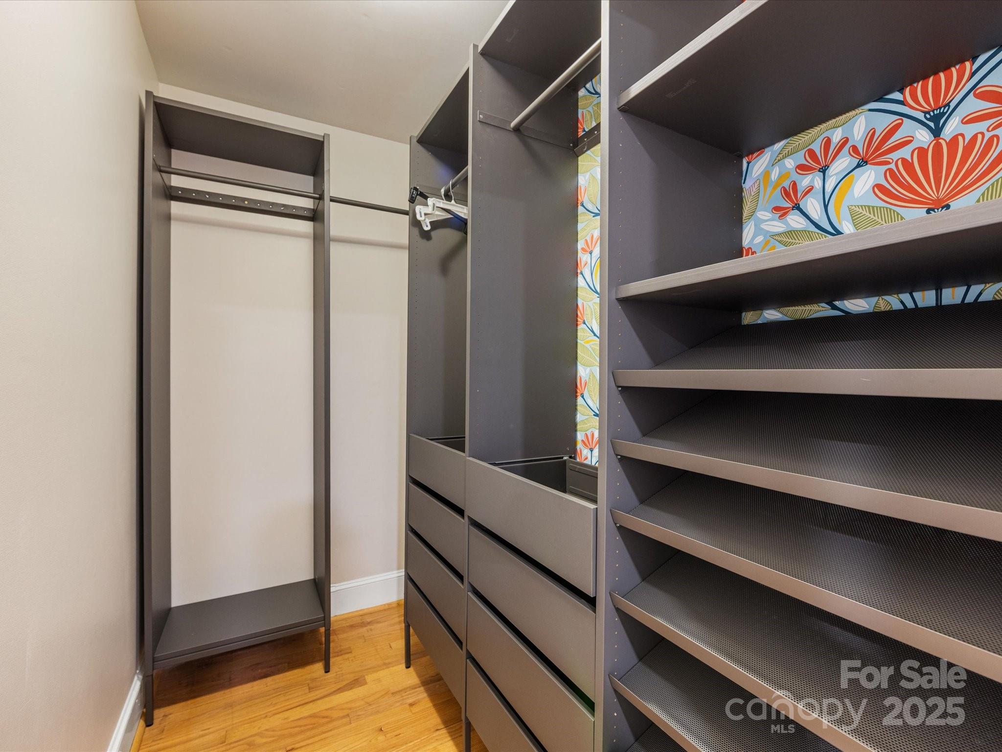 2118 Sharon Road Charlotte, NC 28207 - Photo 22 of 48 a view of walk in closet with clothes and shoes