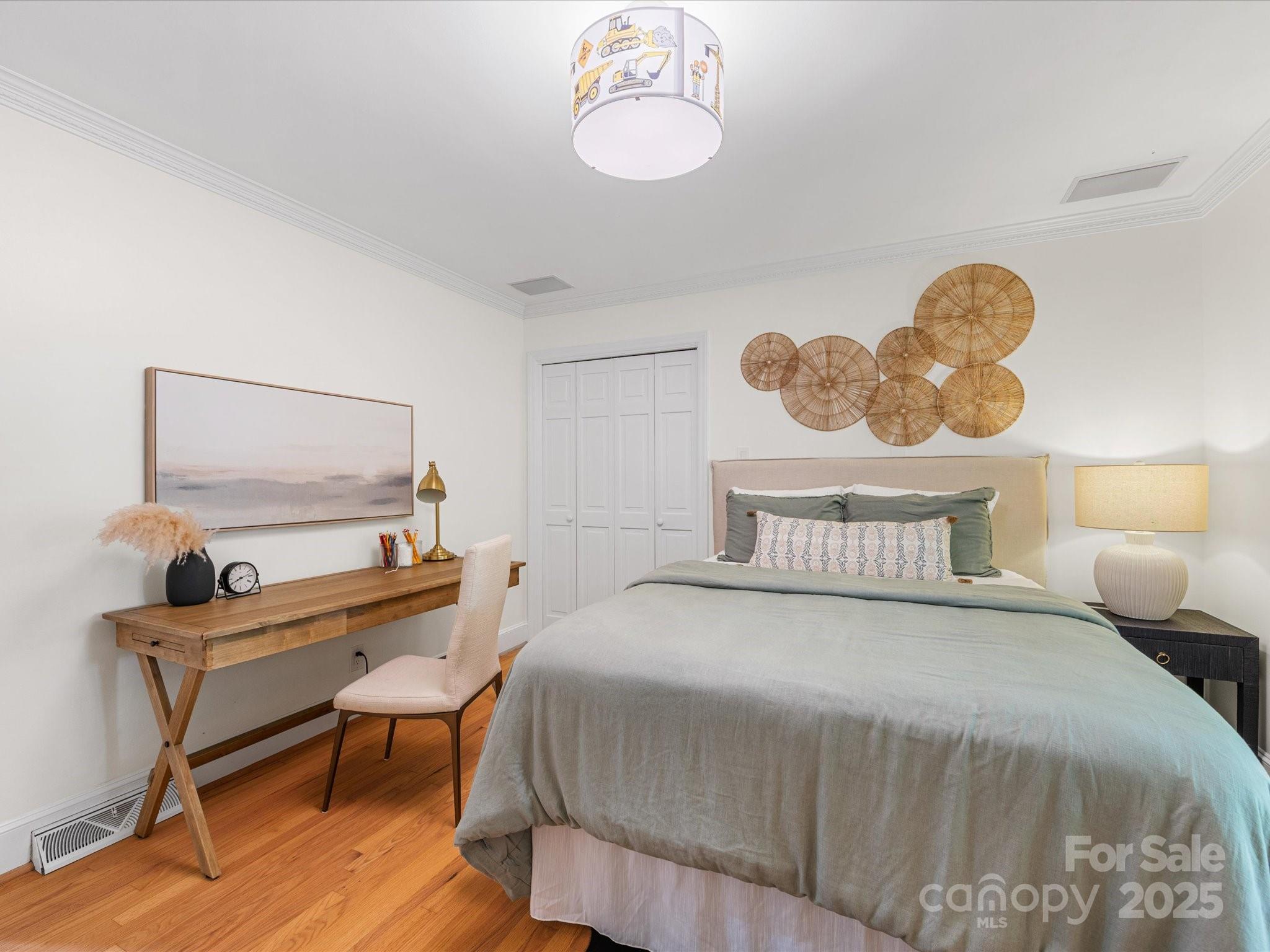 2118 Sharon Road Charlotte, NC 28207 - Photo 25 of 48 a bedroom with a bed and a table
